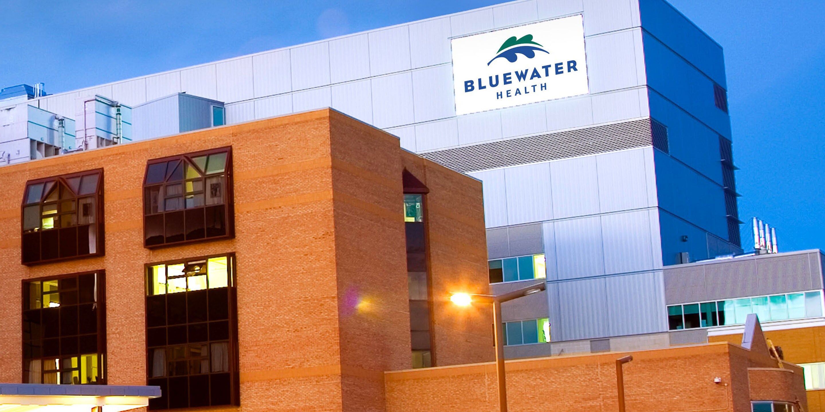 Modern hospital building with brick and glass facade design.